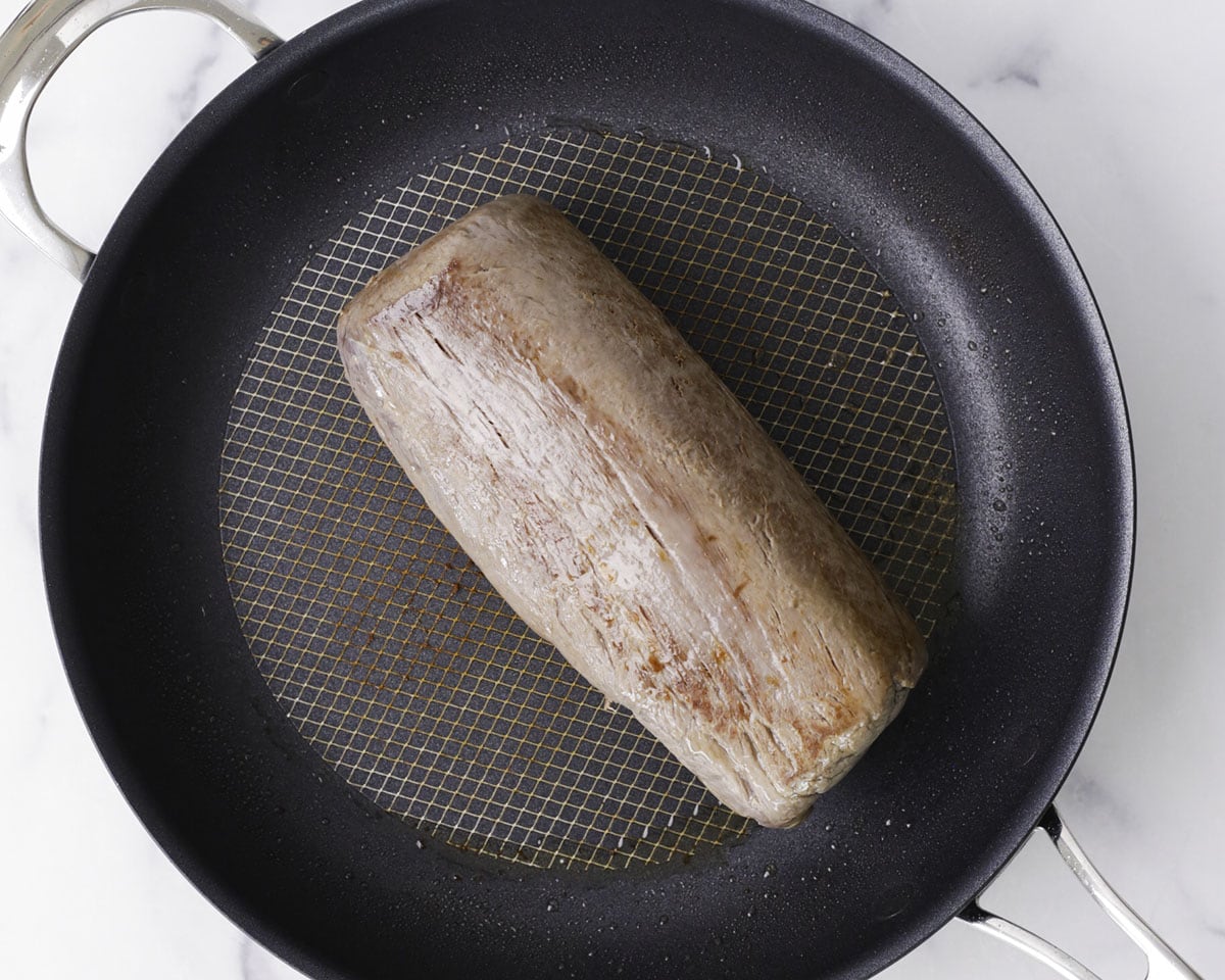Searing the beef in a hot pan