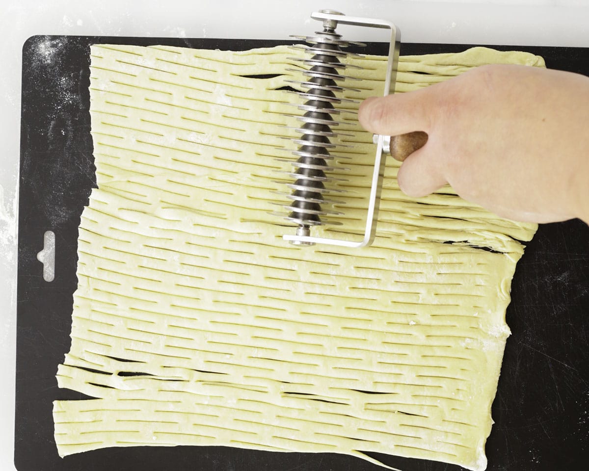Wrapping the beef log with puff pastry