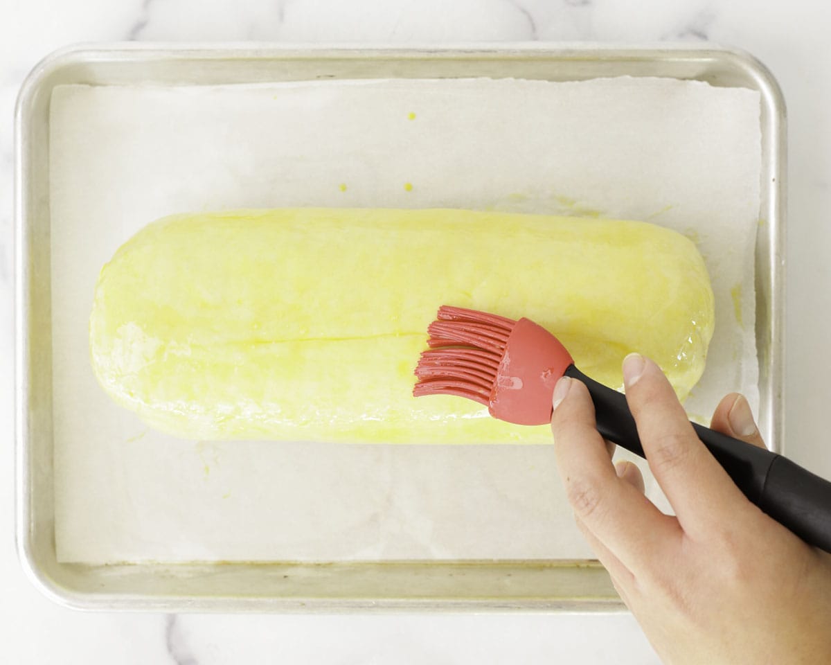 Brushing the Wellington with egg wash