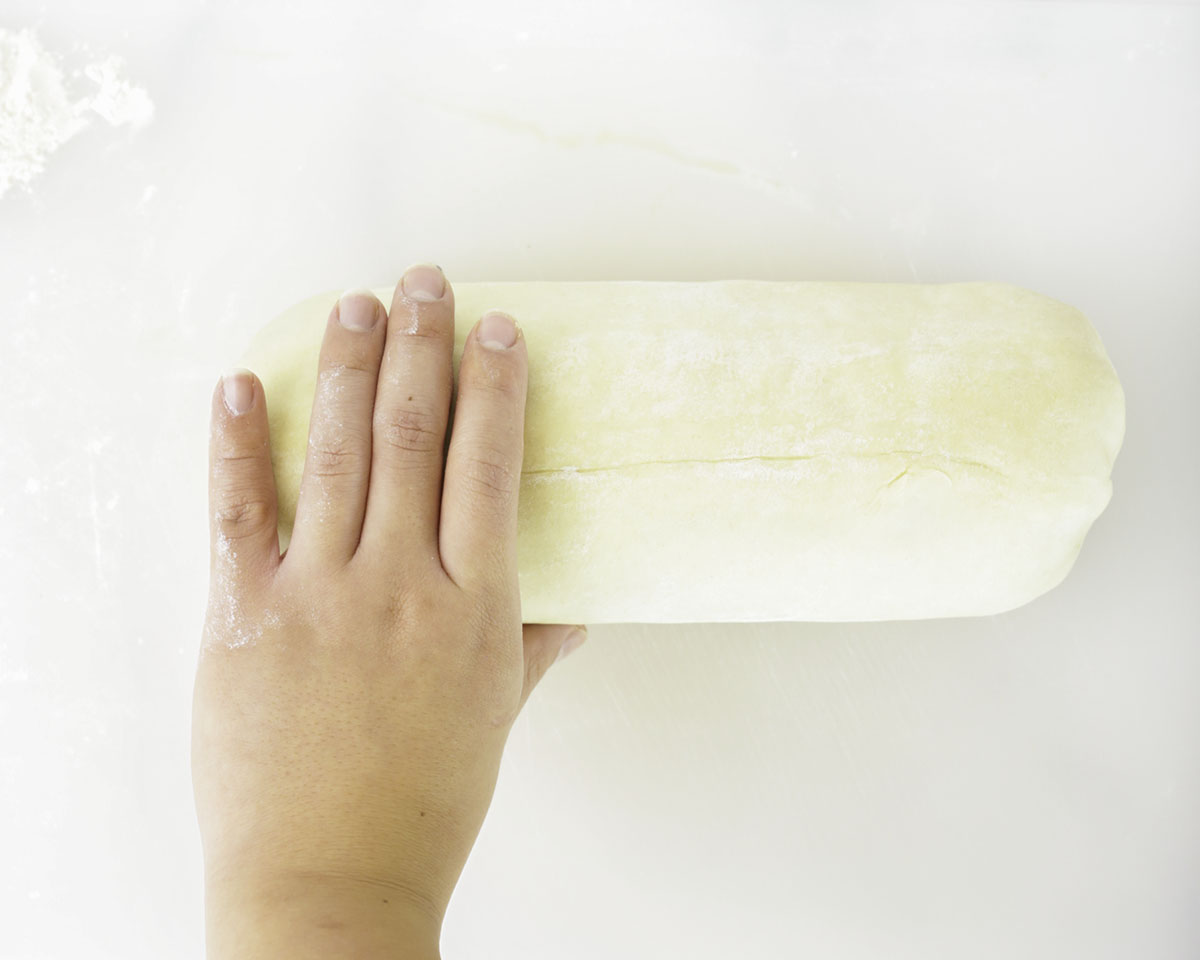 Wrapping the beef log with puff pastry